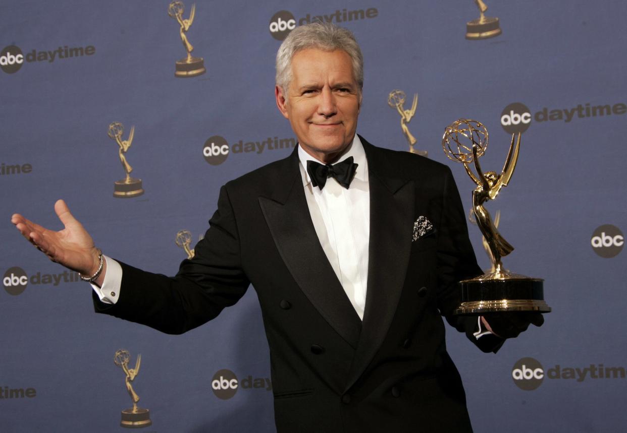 Alex Trebek poses with the award for outstanding game show host for his work on "Jeopardy!" backstage at the 33rd Annual Daytime Emmy Awards in Los Angeles on April 28, 2006.