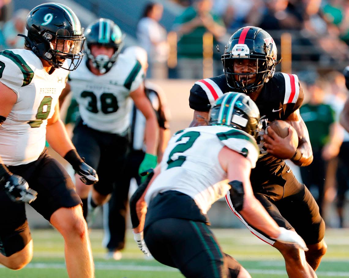 Trinity running back Gary Maddox (3) attempts to avoid the tackle of Prosper’s Carson McClendon (2) in the first half of a high school football game at Pennington Field in Bedford, Texas, Thursday, Aug. 25, 2022. Prosper and Trinity were tied at 7 at the end of the first half. (Special to the Star-Telegram Bob Booth)