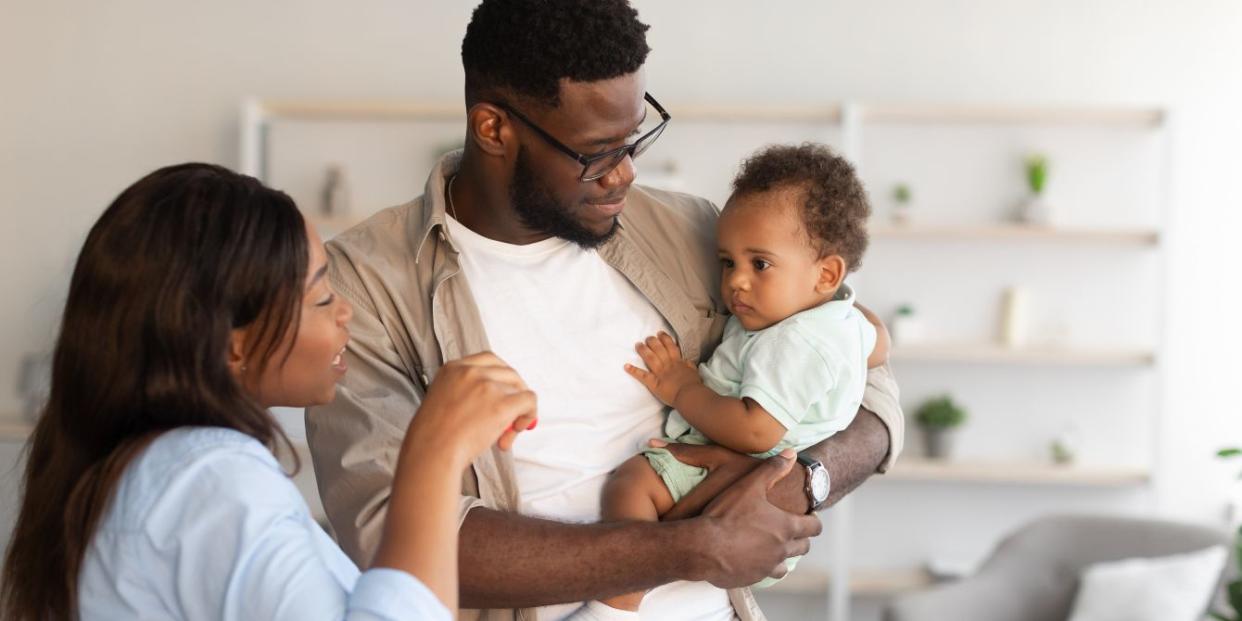 Mom and dad looking at baby