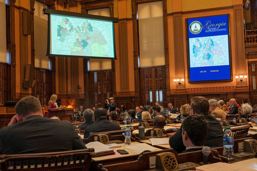 The Georgia House of Representatives votes on a new state House district map, Friday, Dec. 1, 2023, at the Georgia Capitol in Atlanta. Georgia lawmakers were ordered to redraw the state's legislative and congressional districts after a federal judge ruled some illegally diluted Black voting power.