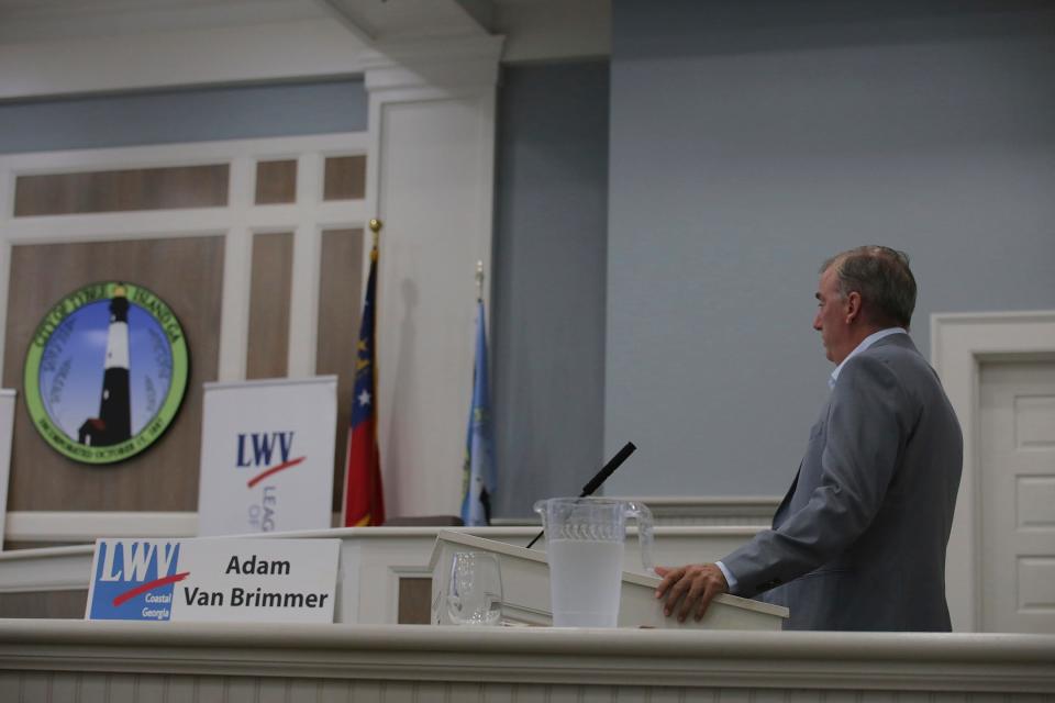 Atlanta Journal-Constitution correspondent and moderator of the Tybee Mayoral Forum, Adam Van Brimmer, asks questions to the candidates on October 4th