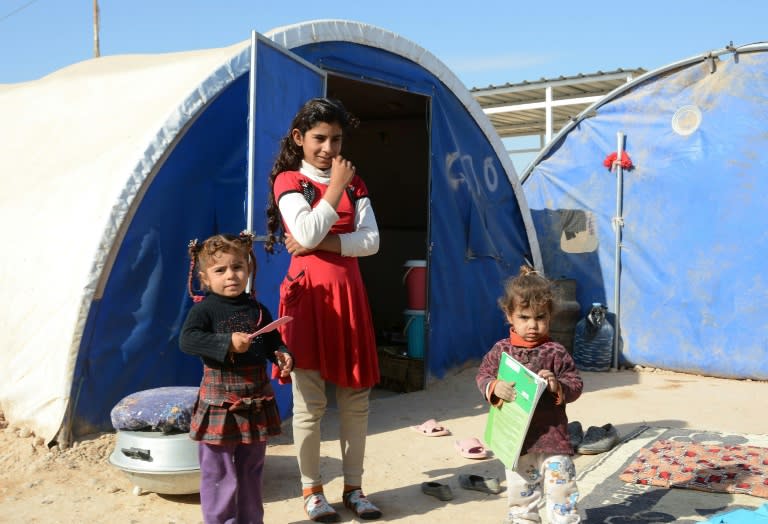 Displaced Iraqi children who fled from Baiji in a camp on the city's outskirts on November 27, 2017