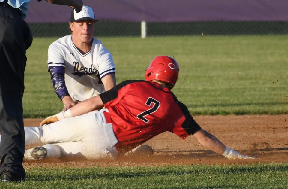 Nevada second baseman Cael Franzen tags Hampton-Dumont-CAL's Cal Heeren during the third inning of the Cubs' 10-7 loss Thursday, June 16, 2022, in Nevada, Iowa.