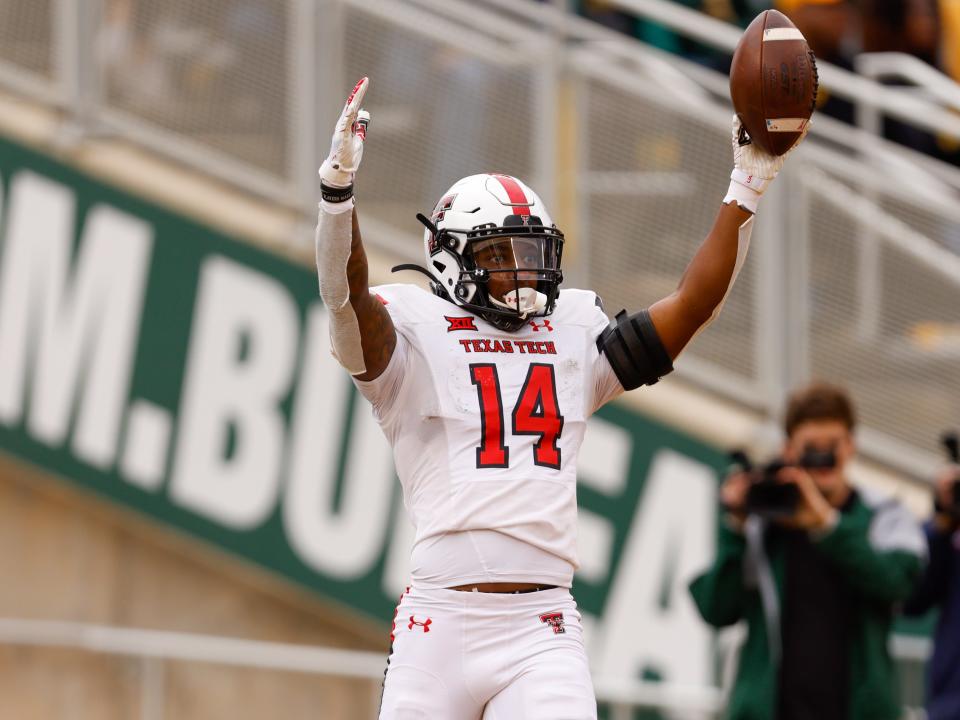 Texas Tech's Xavier White (14) celebrates a touchdown that gets called back during the team’s NCAA football game against Baylor on Saturday, Nov. 27, 2021 at John Eddie Williams Field at McLane Stadium in Waco, Texas.