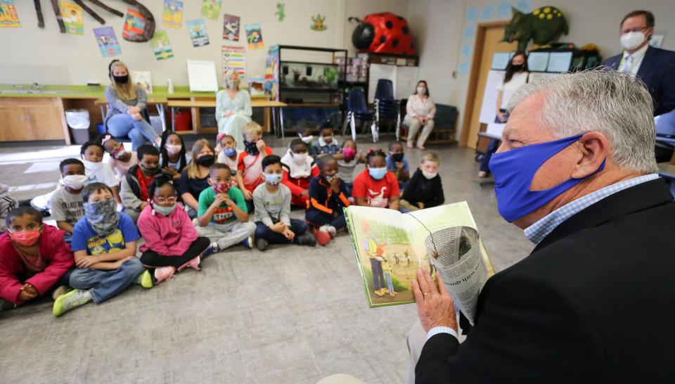 State Senator Gerald Allen reads a book about loggers and forestry to first graders at Woodland Forrest Elementary in Tuscaloosa Monday, April 5, 2021. The book, Lucy Meets A Logger, was written by Stephanie Fuller who's father was a logger. It is an effort by the forestry industry to reach students at an early age. [Staff Photo/Gary Cosby Jr.]