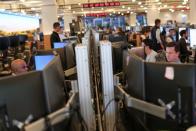 Traders work on the trading floor at the Bank of America Tower in Manhattan, New York City