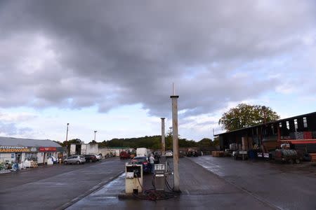 FILE PHOTO: Fuel pump at Fitzpatrick's Fuels and Hardware station marks the exact border line between Northern Ireland (left) and Ireland (right) near the border town of Clones, Ireland, October 17, 2016. REUTERS/Clodagh Kilcoyne/File Photo