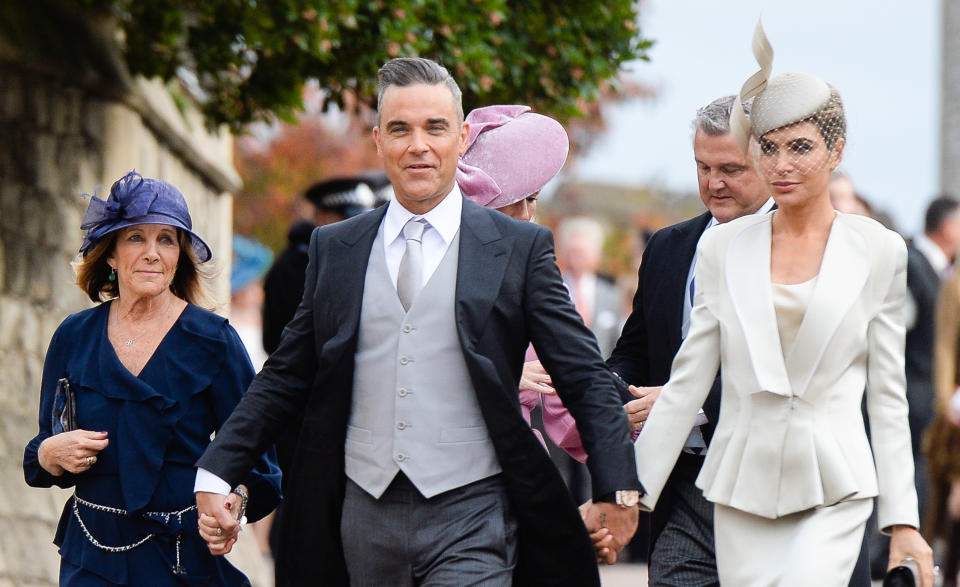 Gwen Field, Robbie Williams and Ayda Field attend the wedding of Princess Eugenie of York and Jack Brooksbank at St George's Chapel in Windsor Castle. (Photo by Pool/Samir Hussein/WireImage)