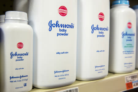 FILE PHOTO: Bottles of Johnson & Johnson baby powder line a drugstore shelf in New York October 15, 2015. REUTERS/Lucas Jackson/File Photo