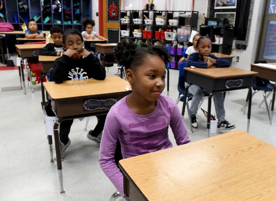 Gabrielle Parms, a second-grade student in teacher Jennifer Schott's class at Worley Elementary School in Canton, listens to the music while participating in the Mindful Music Moments program.