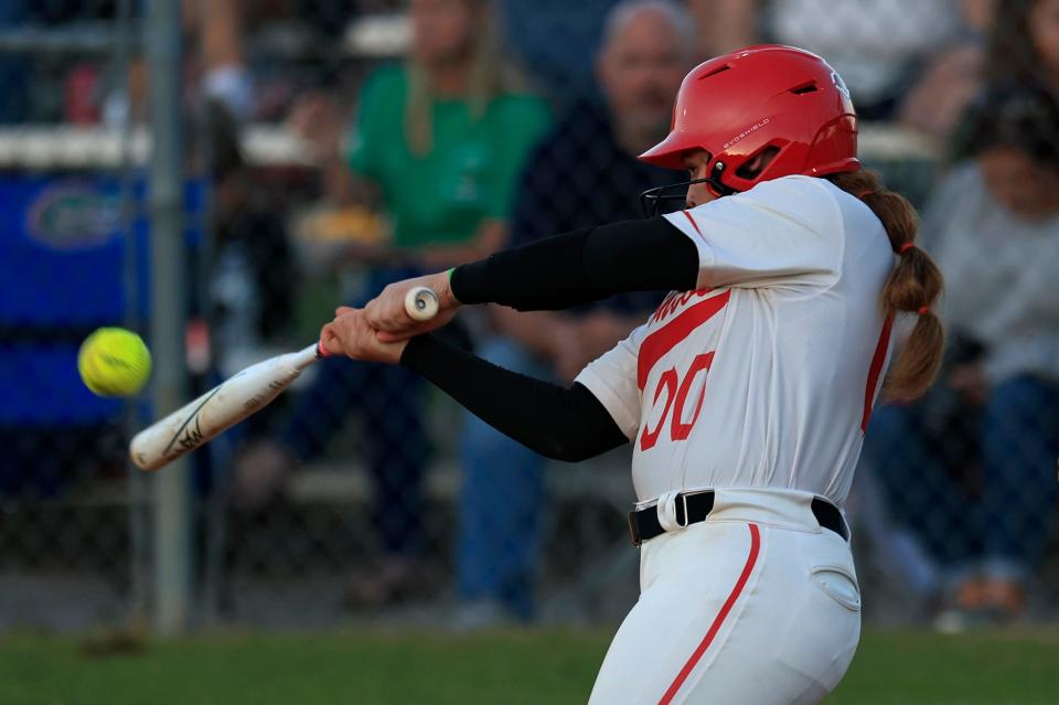 Middleburg's Kerra Clarida (00) makes contact while batting during the fifth inning against Baker County on Tuesday.