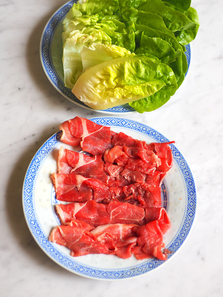 The set includes lamb slices and vegetables for you to cook in the hotpot