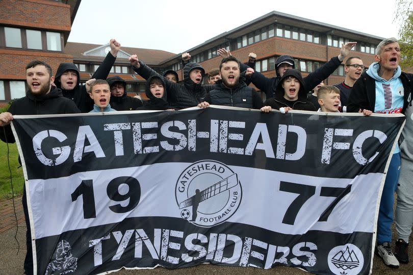 Gateshead FC fans protest outside Gateshead Civic Centre.