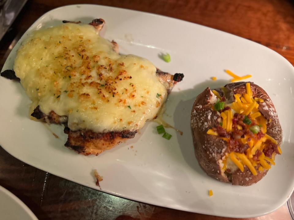 cheesy chicken with loaded baked potato