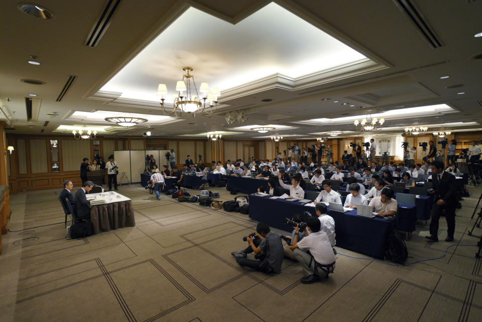 Internal investigation committee members hold a press conference on an investigation on fraud into its admissions process of Tokyo Medical University in Tokyo Tuesday, Aug. 7, 2018. Tokyo Medical University confirmed after the internal investigation that it systematically altered entrance exam scores for years to keep out female applicants and ensure more men became doctors. The manipulated all entrance tests results since 2000 or even earlier. (AP Photo/Eugene Hoshiko)