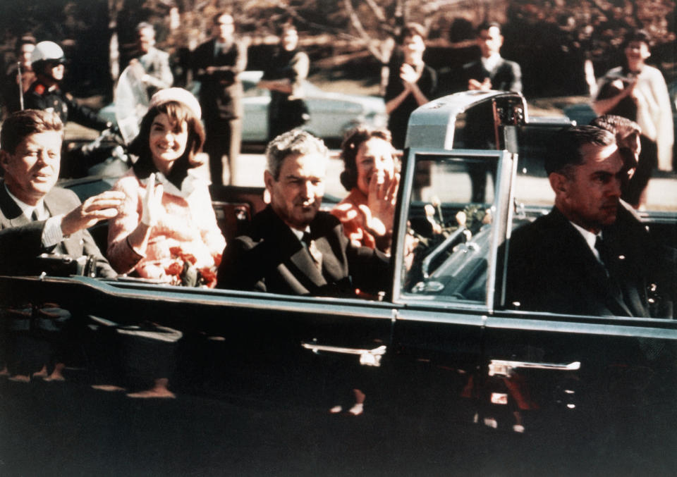 Prior to the assassination, President John F. Kennedy, First Lady Jacqueline Kennedy, and Texas Governor John Connally ride through the streets of Dallas, Texas on November 22, 1963. Included as an exhibit for the Warren Commission. (Photo by © CORBIS/Corbis via Getty Images)