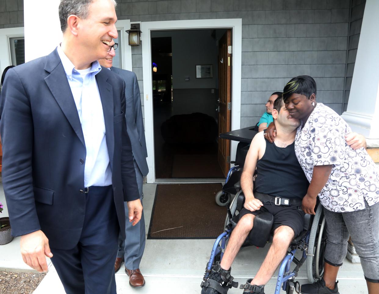 Paul Aronsohn, New Jersey's disability ombudsman, on a 2019 visit to the Eastern Christian Children's Retreat group home.  He met with residents and staff, including Laura Lupica, who led recreational aides at the facility.