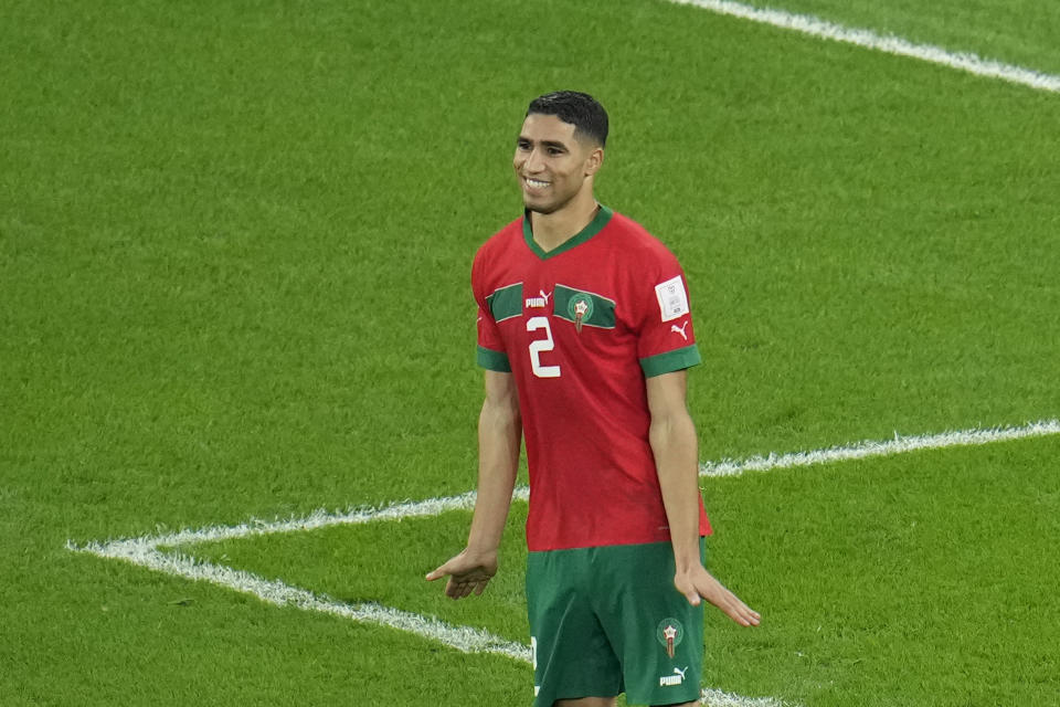 Morocco's Achraf Hakimi celebrates after he scored the decisive penalty at the end of the World Cup round of 16 soccer match between Morocco and Spain, at the Education City Stadium in Al Rayyan, Qatar, Tuesday, Dec. 6, 2022. (AP Photo/Ricardo Mazalan)