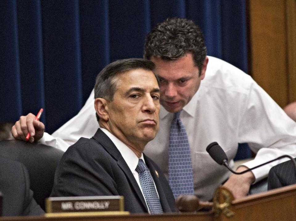 FILE - This May 8, 2013, file photo shows House Oversight Committee Chairman Rep. Darrell Issa, R-Calif., left, confering with Rep. Jason Chaffetz, R-Utah, right, on Capitol Hill in Washington, during a House Oversight Committee hearing about the deadly assault on the U.S. diplomatic mission in Benghazi, Libya. The testimony of nine military officers severely undermines claims by Republican lawmakers that a “stand-down order” held back military assets who could have saved the U.S. ambassador and three other Americans killed during the assult. (AP Photo/J. Scott Applewhite, File)