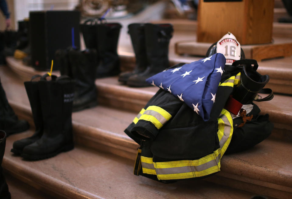 SAN FRANCISCO, CA - MARCH 26:  Firefighter boots line the stairs inside San Francisco City Hall during a remembrance ceremony held for San Francisco firefighters who have died of cancer on March 26, 2014 in San Francisco, California. Over two hundred pairs of boots were displayed on the steps inside San Francisco City Hall to symbolize the 230 San Francisco firefighters who have died of cancer over the past decade. According to a study published by the National Institute for Occupational Safety and Health, (NIOSH)  findings indicate a direct correlation between exposure to carcinogens like flame retardants and higher rate of cancer among firefighters.  The study showed elevated rates of respiratory, digestive and urinary systems cancer and also revealed that participants in the study had high risk of mesothelioma, a cancer associated with asbestos exposure.  (Photo by Justin Sullivan/Getty Images)