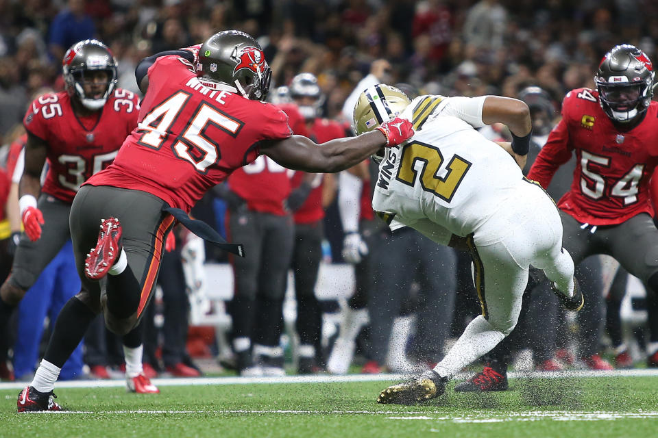 Jameis Winston of the New Orleans Saints is injured after being tackled by Devin White of the Tampa Bay Buccaneers. (Photo by Sean Gardner/Getty Images)