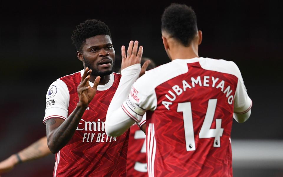 Pierre-Emerick Aubameyang celebrates scoring Arsenal's 1st goal with Thomas Partey during the Premier League match between Arsenal and Newcastle United - GETTY IMAGES