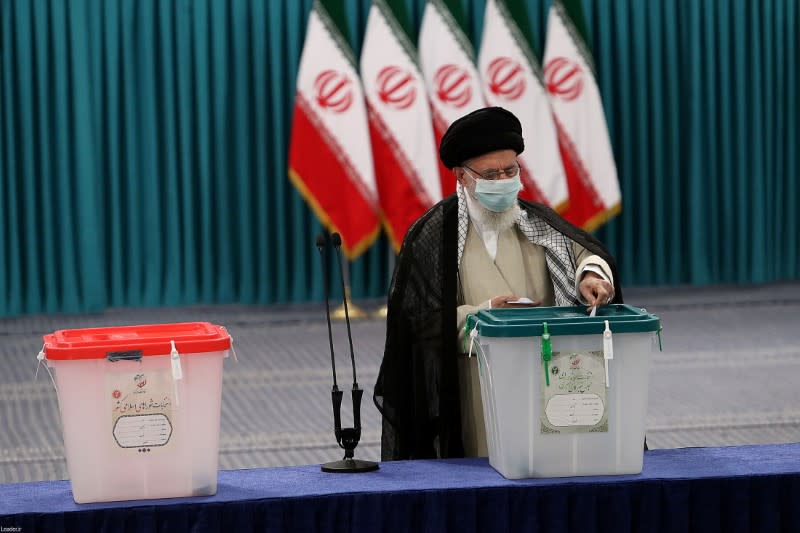 Iran's Supreme Leader Ayatollah Ali Khamenei casts his vote during Iranian presidential election in Tehran