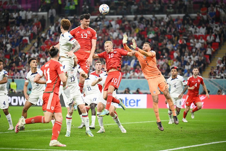 Kieffer Moore of Wales heads the ball towards goal during the FIFA World Cup Qatar 2022 Group B match between USA and Wales at Ahmad Bin Ali Stadium on November 21, 2022 in Doha, Qatar.