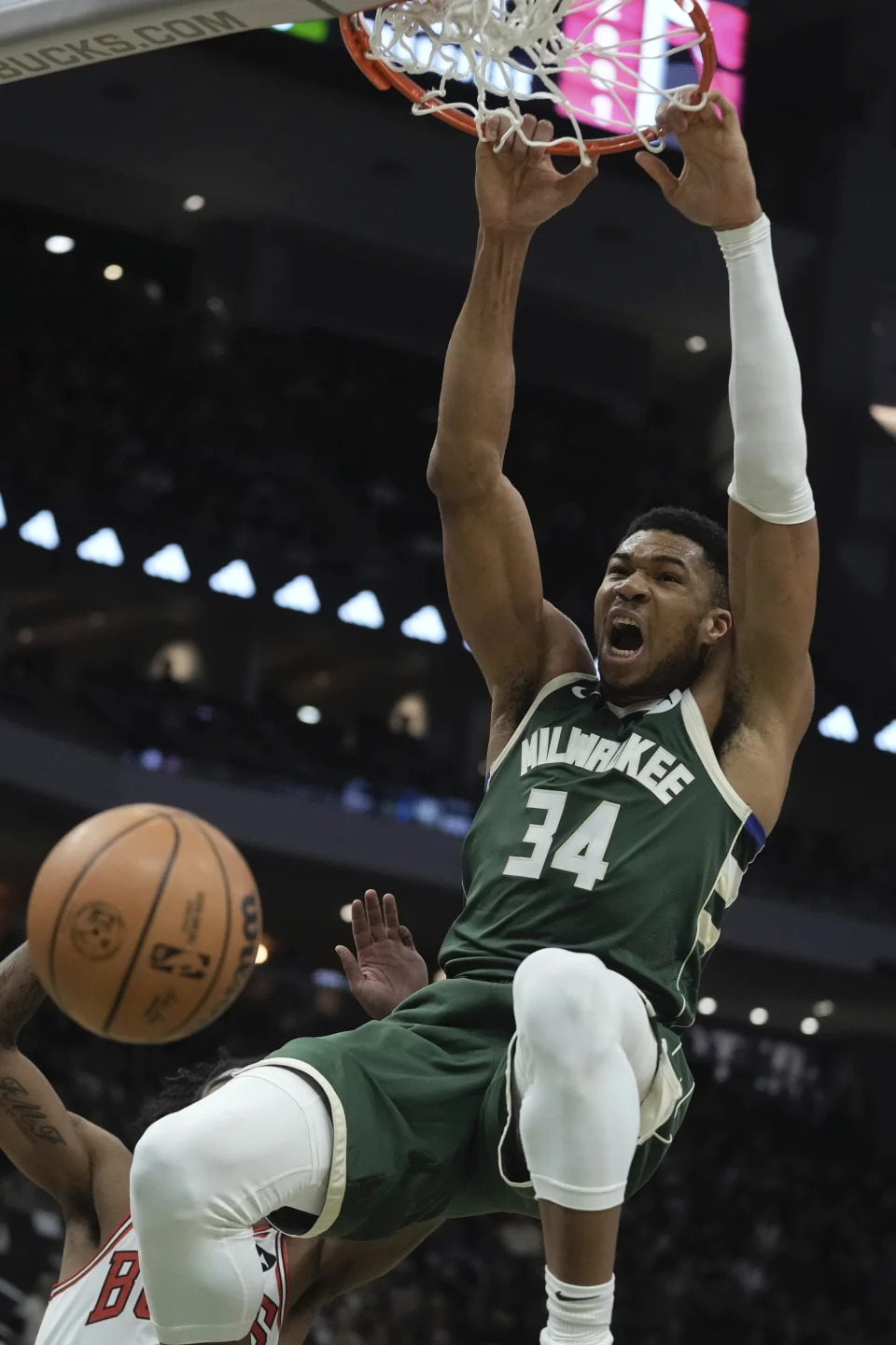 Milwaukee Bucks' Giannis Antetokounmpo dunks during the first half of an NBA basketball game Monday, Dec. 11, 2023, in Milwaukee. (AP Photo/Morry Gash)