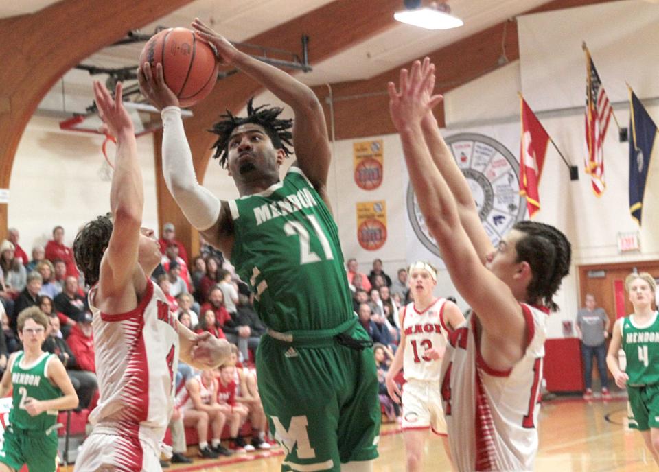 Jack McCaw glides in between Colon defenders for a shot in the district finals on Friday.