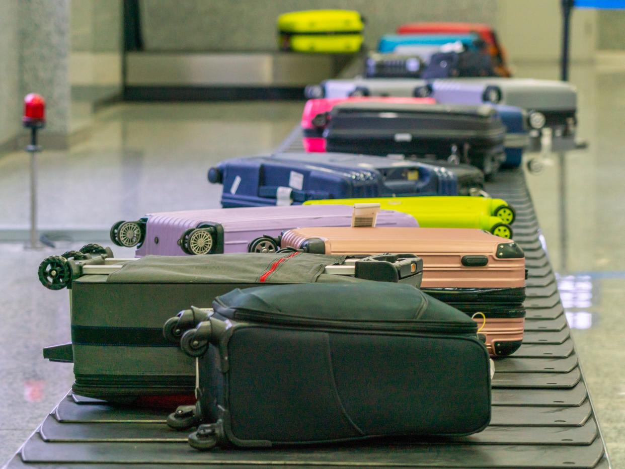 suitcases conveyor belt airport