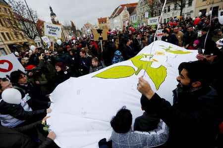 People attend a demonstration against discrimination of migrants in Cottbus, Germany February 3, 2018. REUTERS/Hannibal Hanschke