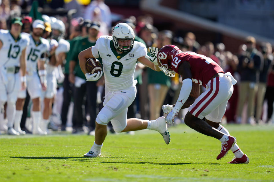 Nov 5, 2022; Norman, Oklahoma, USA; Baylor Bears tight end Ben Sims (8) makes a catch as Oklahoma Sooners defensive back Key Lawrence (12) defends during the first half at Gaylord Family-Oklahoma Memorial Stadium. Mandatory Credit: Chris Jones-USA TODAY Sports