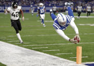 <p>Indianapolis Colts tight end Eric Ebron (85) dives in for a touchdown in front of Jacksonville Jaguars strong safety Barry Church (42) during the first half of an NFL football game in Indianapolis, Sunday, Nov. 11, 2018. (AP Photo/Michael Conroy) </p>