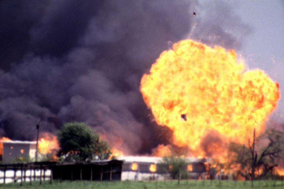 The Branch Davidian compound explodes on April 19, 1993.