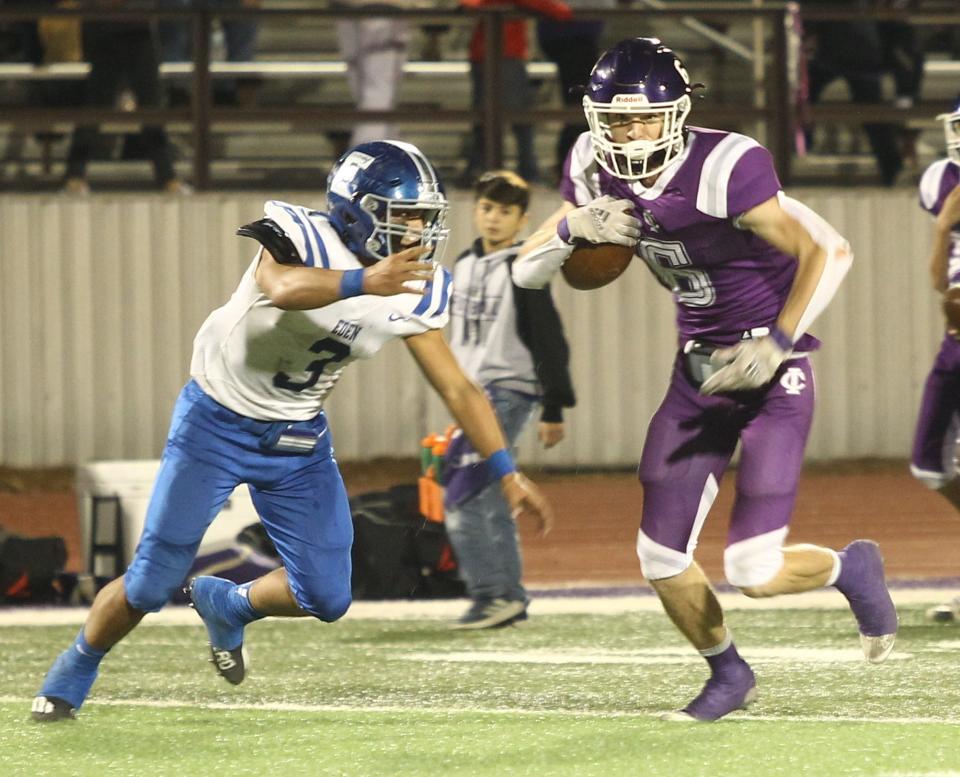 Irion County High School's Bo Morrow turns his eyes upfield after a reception against Eden as the Bulldogs' Julian Gamboa defends in a District 14-1A Division I football game Friday, Nov. 5, 2021 at O.K. Wolfenbarger Field in Mertzon.