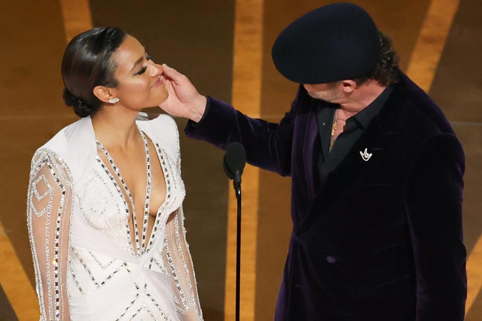 Ariana DeBose and Troy Kotsur present the awards for actress and actor in a supporting role at the 95th Academy Awards in the Dolby Theatre on March 12, 2023 in Hollywood, California.