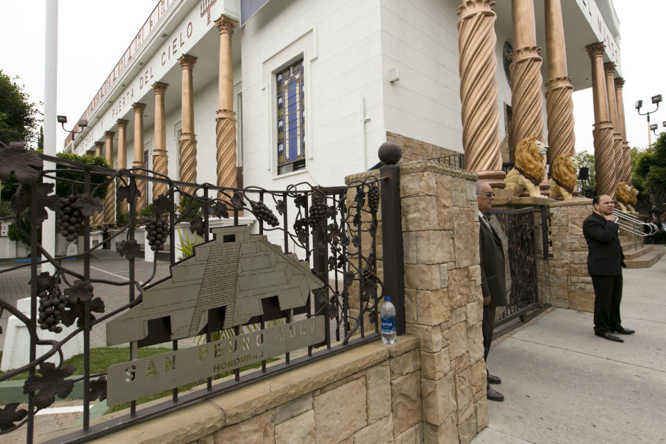 Members of the Mexico-based evangelical megachurch La Luz del Mundo stand outside the East Los Angeles temple on Friday, June 7, 2019. La Luz del Mundo leader and self-proclaimed apostle Naason Joaquin Garcia and two co-defendants were arrested in California this week, and a fourth remains at large. They face a 26-count felony complaint that alleges crimes including child rape, statutory rape, molestation, human trafficking, child pornography and extortion. (AP Photo/Damian Dovarganes)