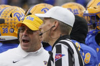 Pittsburgh head coach Pat Narduzzi, left, talks with referee Jeff Heaser after the Pitt defense appeared down Miami running back Jaylan Knighton (4) for a safety in the second half of an NCAA college football game, Saturday, Oct. 30, 2021, in Pittsburgh. The officials ruled that Knighton made it out of the end zone, nullifying a safety. Miami won 38-34. (AP Photo/Keith Srakocic)