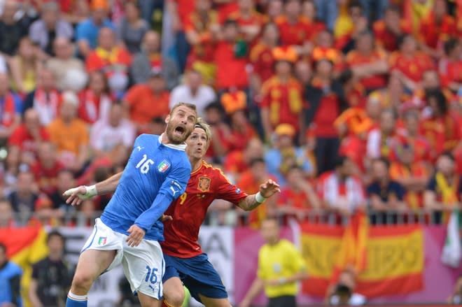 Italian midfielder Daniele De Rossi (L) vies with Spanish forward Fernando Torres during the Euro 2012 championships football match Spain vs Italy on June 10, 2012 at the Gdansk Arena. AFP PHOTO/ GIUSEPPE CACACEGIUSEPPE CACACE/AFP/GettyImages