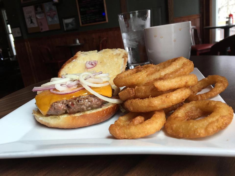 Grass-fed burger and onion rings from Nail Creek Pub & Brewery in Utica.