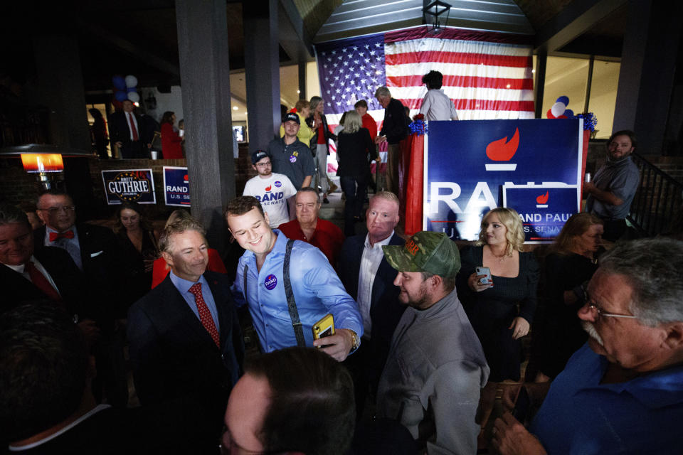 Sen. Rand Paul, R-Ky, poses for a photo with supporter John French at Paul's election-night watch party in Bowling Green, Ky., Tuesday, Nov. 8, 2022. (AP Photo/Michael Clubb)