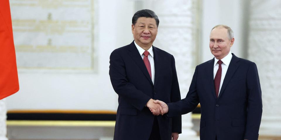 Russian President Vladimir Putin shakes hands with Chinese President Xi Jinping during a welcome ceremony before Russia - China talks in narrow format at the Kremlin in Moscow, Russia March 21, 2023.