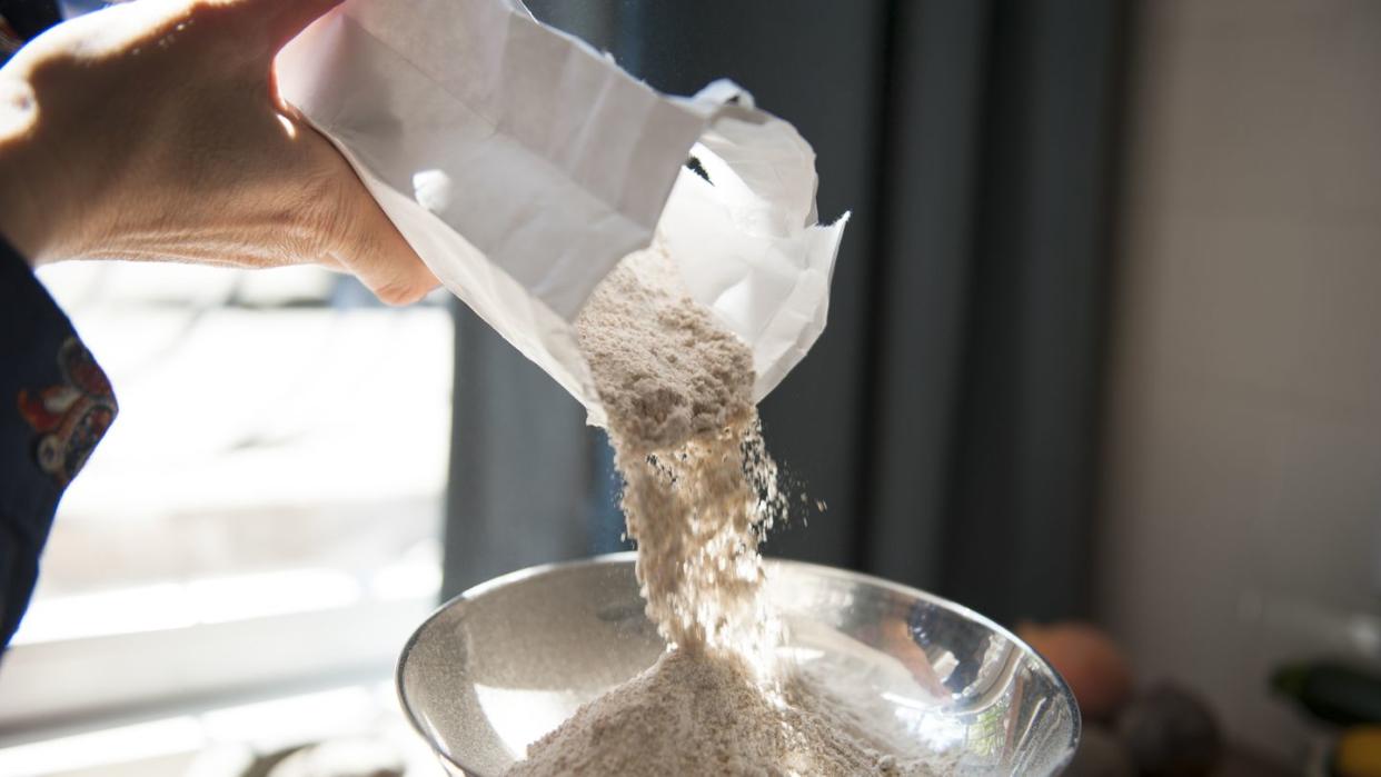 making bread, weighing flour