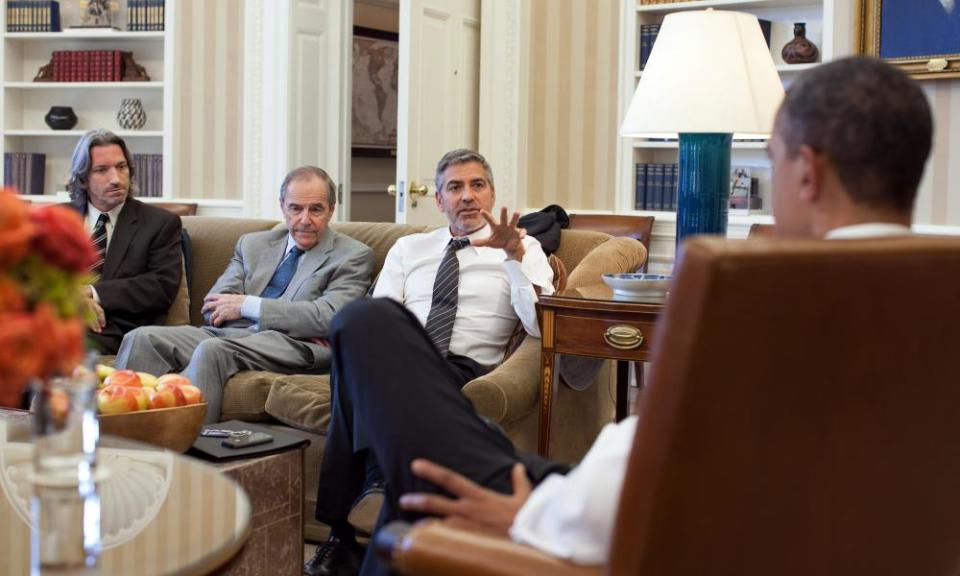 Missing in action … left to right, John Prendergast; Princeton N Lyman, US special envoy for Sudan; and George Clooney meet President Obama in 2012.