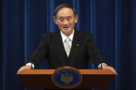 FILE - In this Sept. 16, 2020, file photo, Japan's new Prime Minister Yoshihide Suga speaks during a press conference at the prime minister's official residence in Tokyo, Japan. Japan's new Prime Minister Suga heads to Vietnam and Indonesia on Sunday, Oct. 18, 2020, on his first overseas foray since taking over from his former boss Shinzo Abe last month. (Carl Court/Pool Photo via AP, File)