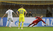 PSV's Gaston Pereiro, left, scores his side's goal during the Champions League play-off round, 1st leg soccer match between Bate and PSV at the Borisov-Arena stadium in Borisov, Belarus, Tuesday, Aug. 21, 2018. (AP Photo/Sergei Grits)