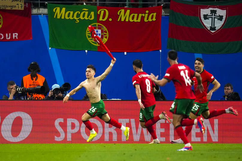 Portugal's Francisco Conceicao, left, celebrates with teammates after scoring against the Czech Republic