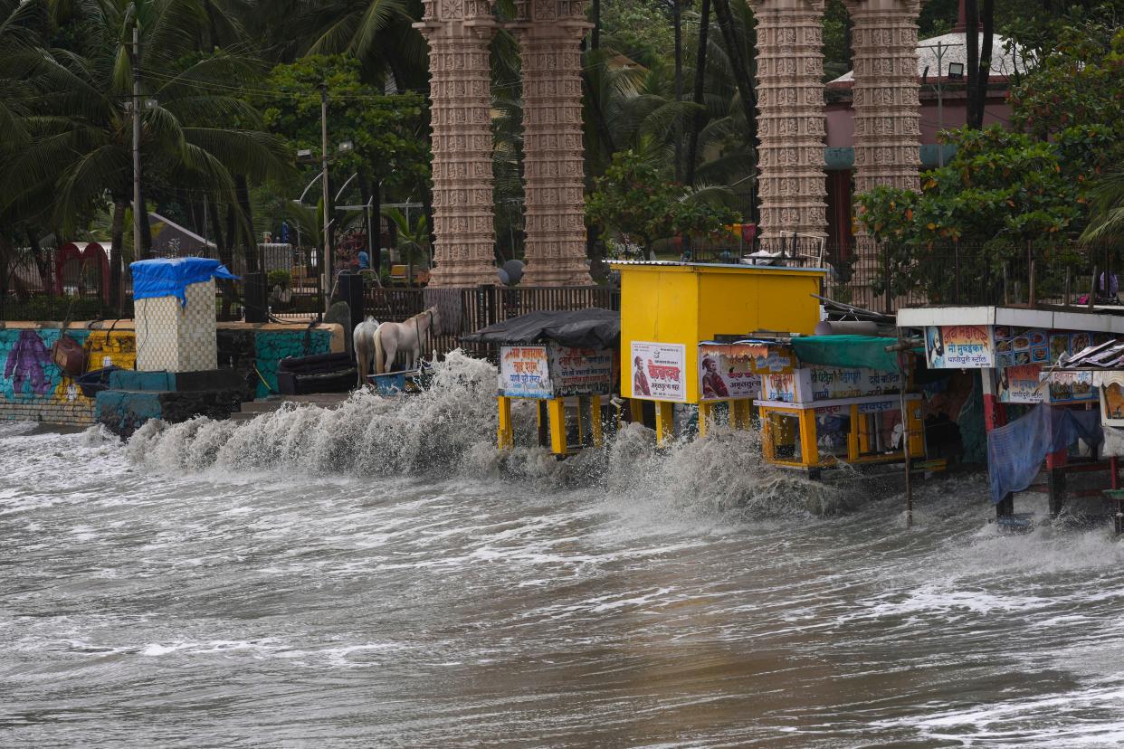 Waves hit the stalls on the beach during high tide on the Arabian Sea coast in Mumbai, India (AP)