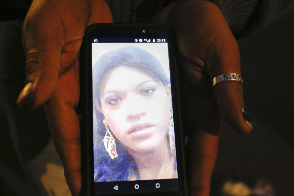 In this Aug. 28, 2019 photo, trans rights activist Kenya Cuevas holds a cellphone that shows an image of her slain friend Paola Buenrostro, in Mexico City. On Sept. 29, 2016 Buenrostro got into a client's Nissan compact car and was shot multiple times. Despite multiple witnesses, Buenrostro's alleged killer was released from custody a few days later. (AP Photo/Ginnette Riquelme)